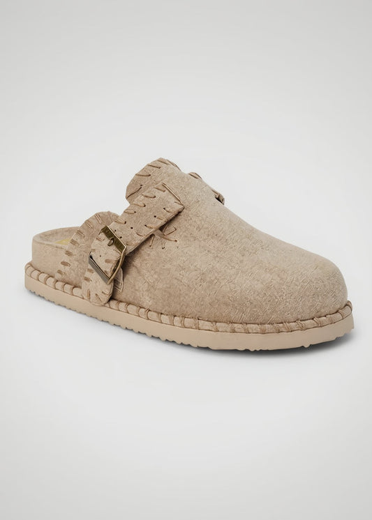Beige clog shoe with a gold buckle on a white background