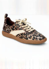 Leopard print sneaker with brown sole on a white background